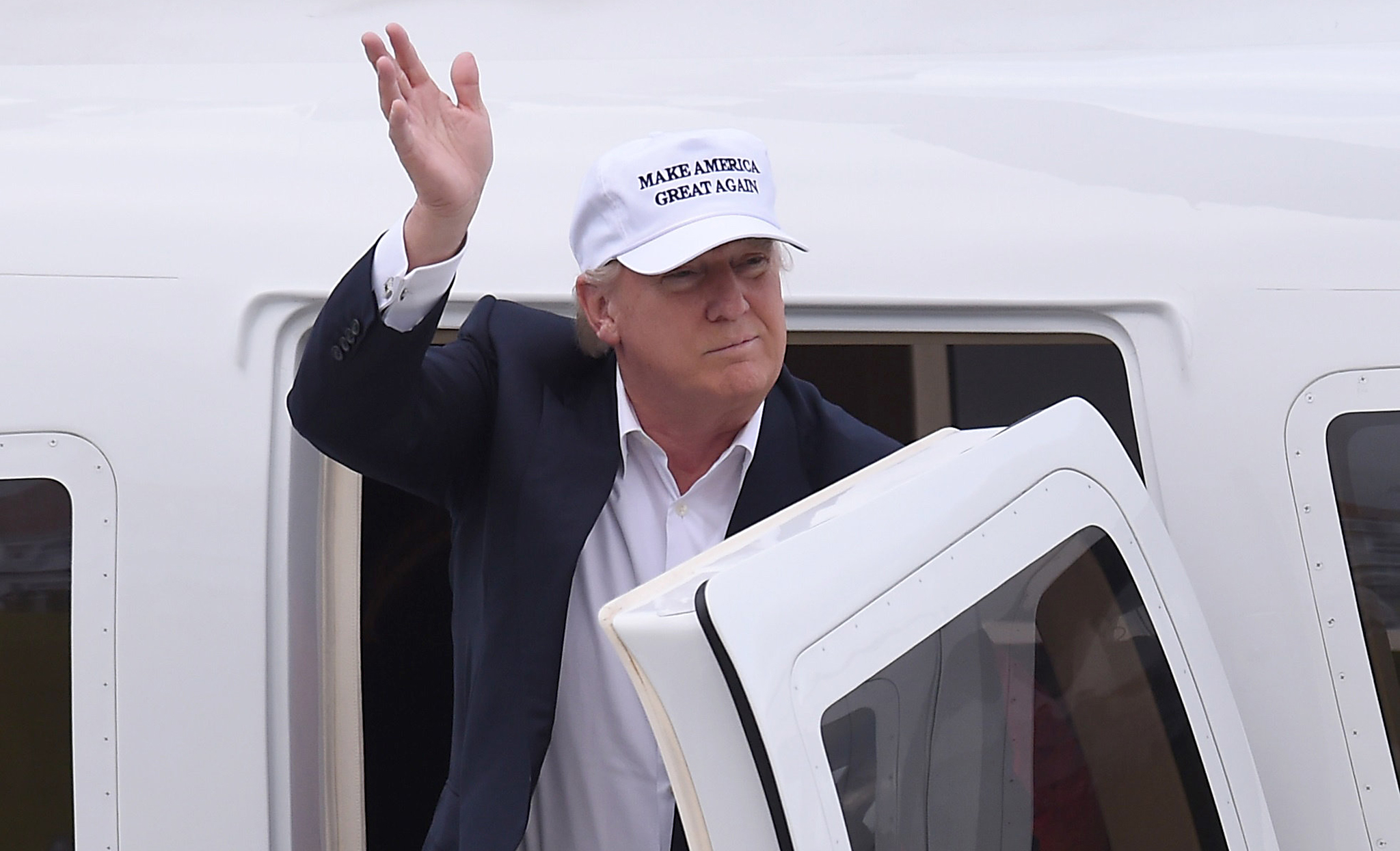 Republican presidential candidate Donald Trump waves as he arrives at his Turnberry golf course, in Turnberry, Scotland, Britain June 24, 2016. REUTERS/Clodagh Kilcoyne