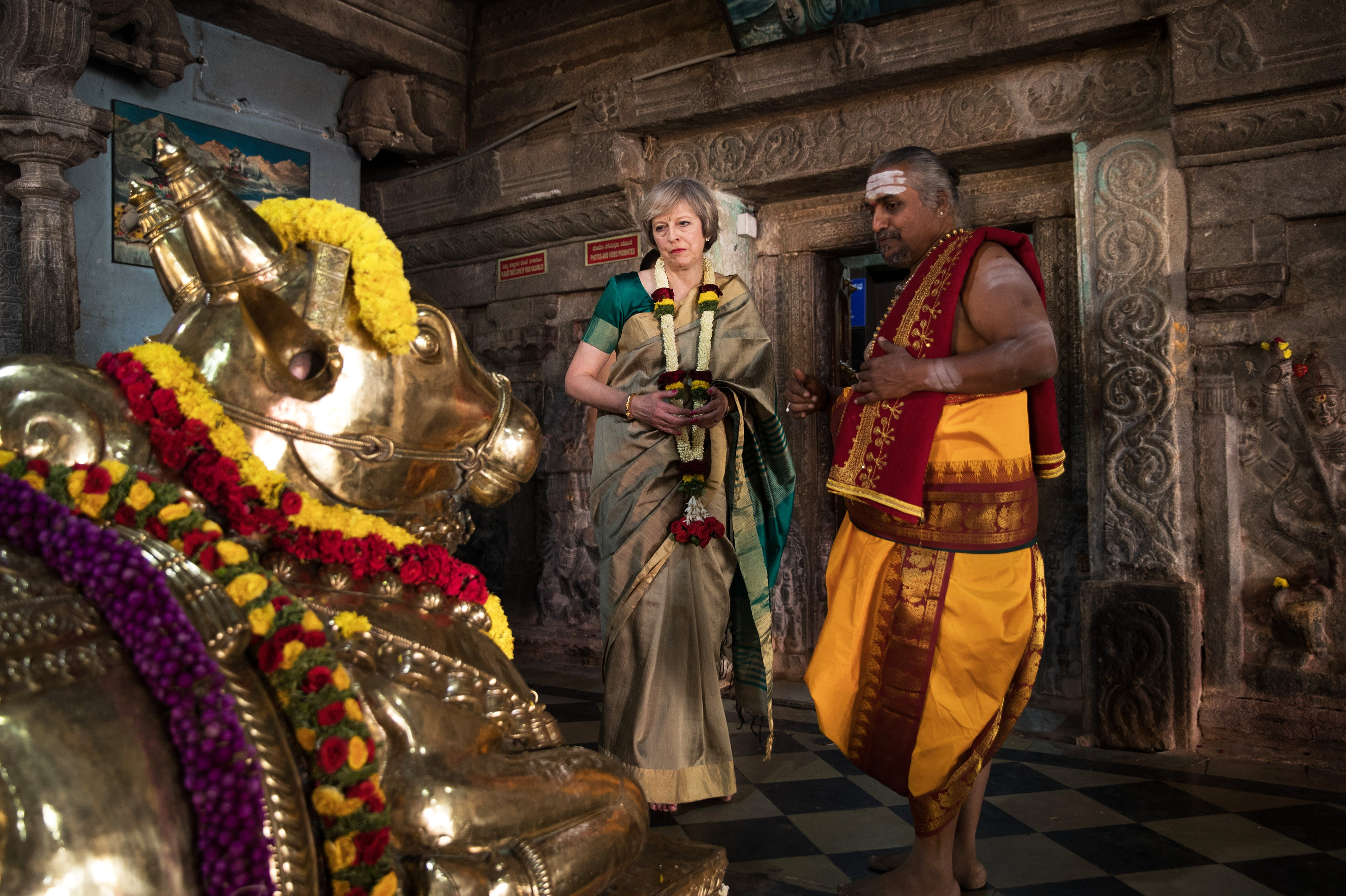 British Prime Minister Theresa May is welcomed to the Sri Someshwara Temple on November 8, 2016 in Bangalore, India. Mrs May is in India on a two day trade mission to reconnect the UK with the Commonwealth during her first trip since taking office. Yesterday the Prime Minister met with Indian Prime Minister Narendra Modi. (Photo by Dan Kitwood/Getty Images)