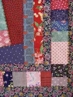 detail of quilt by Robin Atkins, bead artist