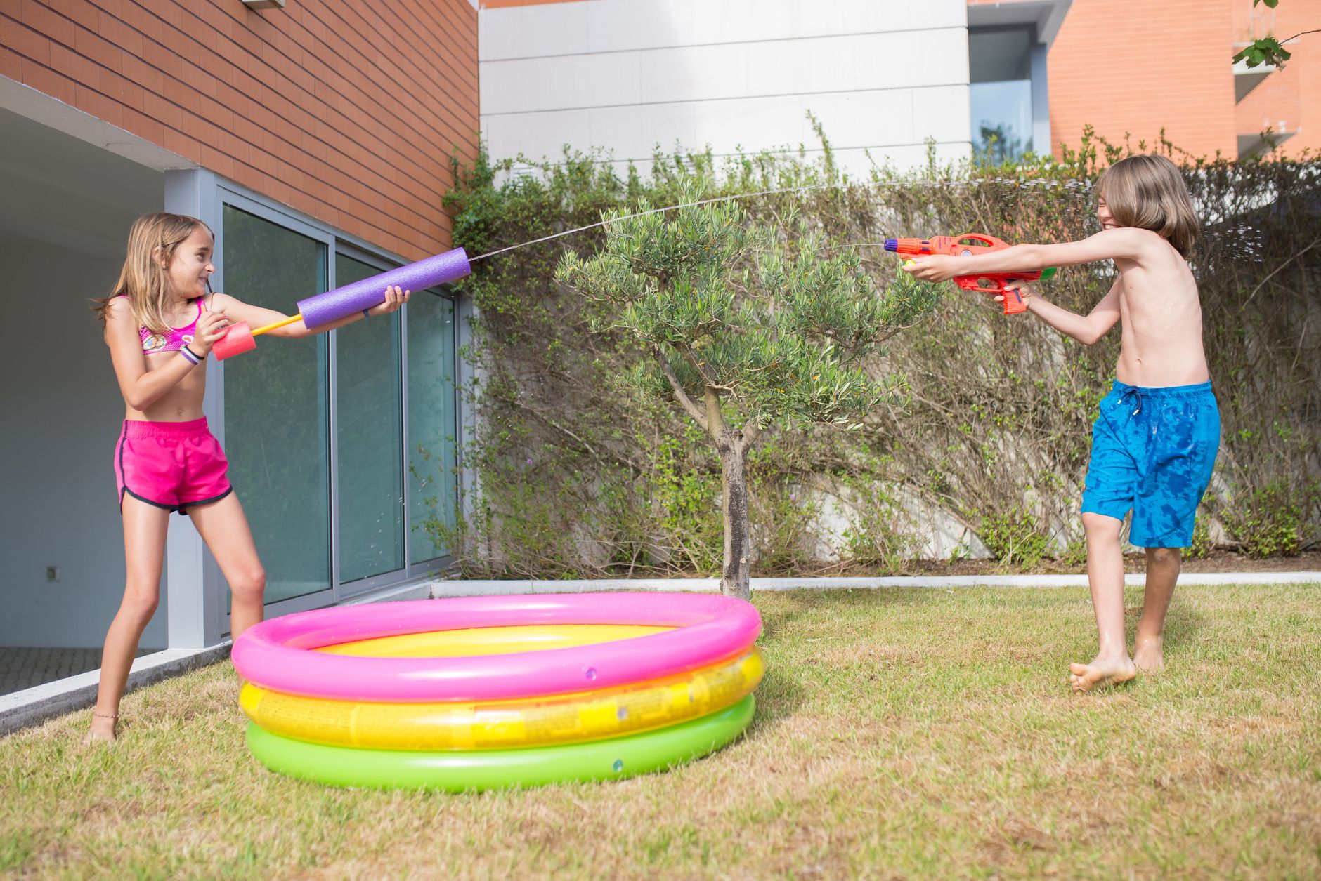 children shooting water guns
