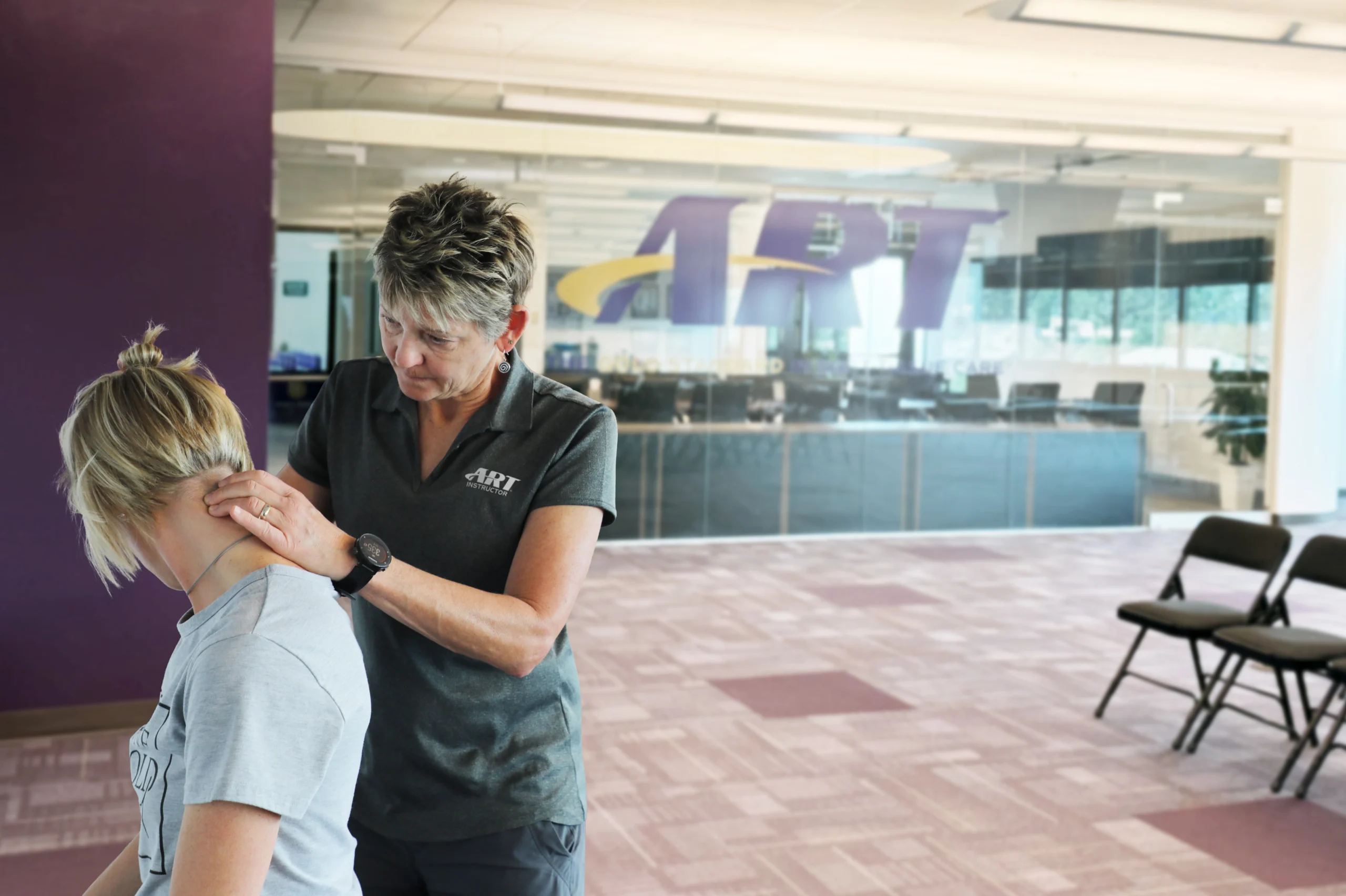 active release techniques provider demonstrating upper extremity soft-tissue treatment