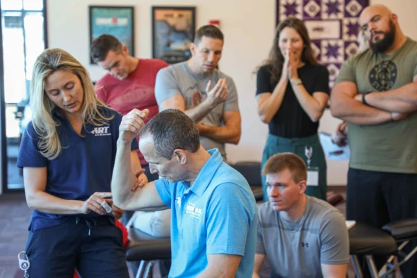 active release techniques instructors showing protocols at a CE seminar