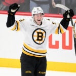 Boston Bruins center Fraser Minten (93) celebrates his game-winning goal in a shootout in an NHL hockey game against the Washington Capitals, Saturday, March 14, 2026, in Washington. (AP Photo/Nick Wass)