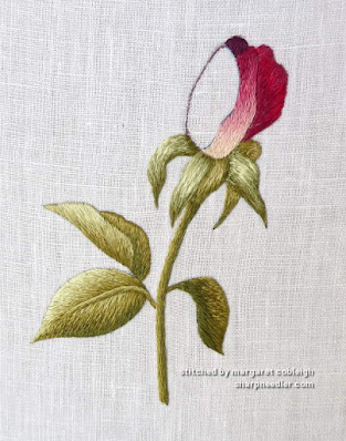 Embroidering the Bud Embroidered rosebud in progress (needlepainting design by Trish Burr)