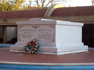 The white double tomb of Dr. and Mrs. King in the blue reflecting pool