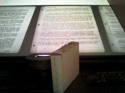 a box sitting on the microfilm reader