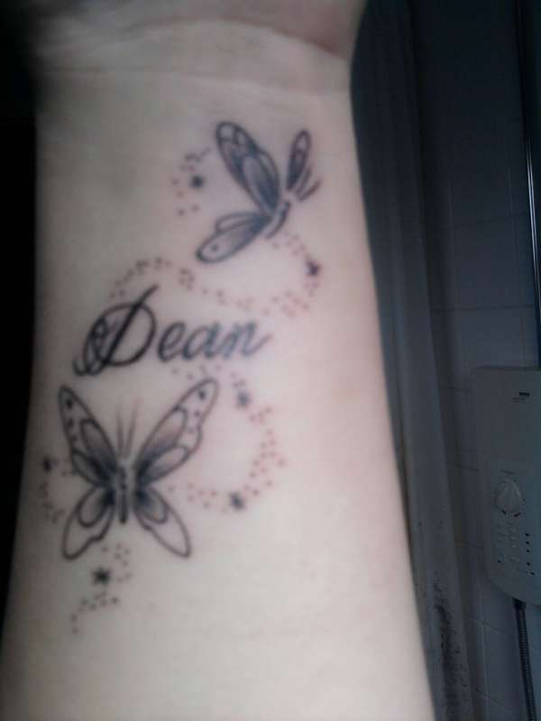 Butterfly and name tattoo on wrist tattoo Butterfly and name tattoo on wrist tattoo