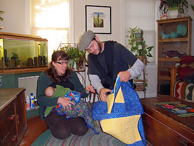 my nephew looking at the new quilt