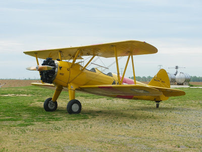 a bright yellow biplane