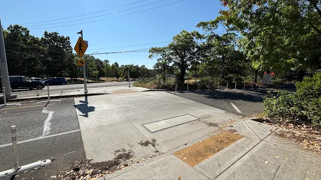 A raised crosswalk on a freeway on-ramp.