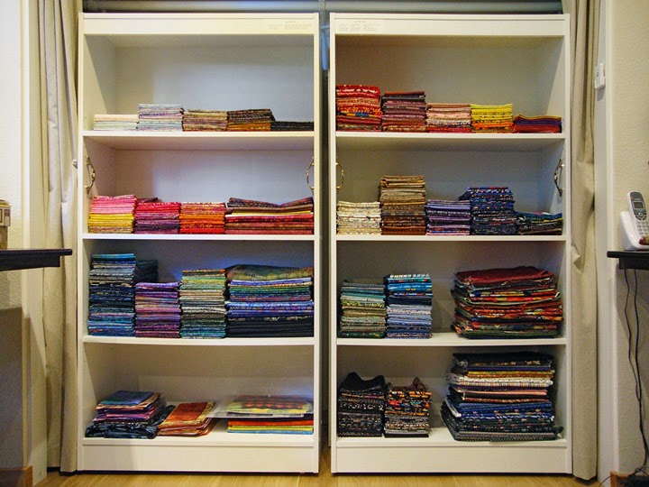 frabric storage system: Front shelf units filled with cotton batiks and prints frabric storage system: Front shelf units filled with cotton batiks and prints