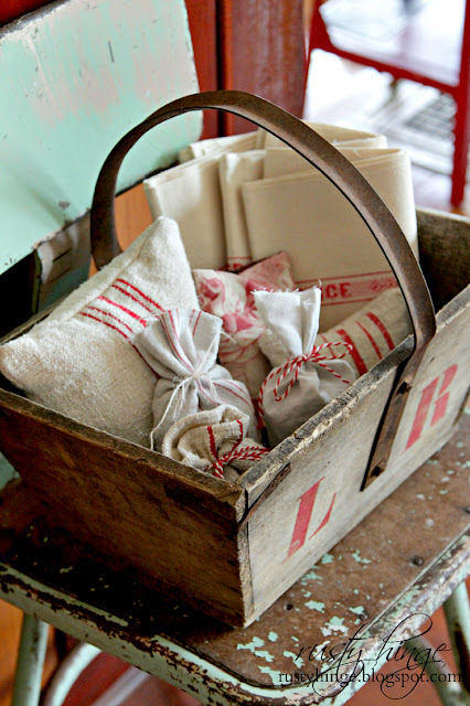 Rusty Hinge 2015 Rustic Meets Refined Christmas Home Tour Vintage French trug filled with red and white antique French linens