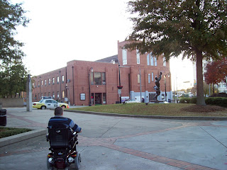 Viewed from the back, Mark goes towards Ebenezer Baptist Church across the street from the King Center