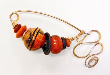 fibula pin by robin atkins, orange black
