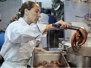 Chef Gabriela Cámara at work Still photo showing a woman cooking seafood