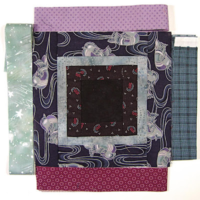 God's Eye quilt by Robin Atkins, auditioning fabrics