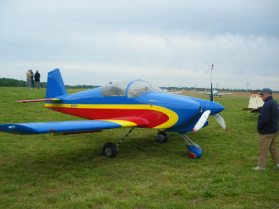 a gleaming red, blue and yellow airplane
