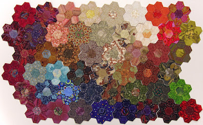 Robin Atkins, hexie quilt, 49 stitched hexie flowers made with Thom Atkins fabric scraps Robin Atkins, hexie quilt, 49 stitched hexie flowers made with Thom Atkins fabric scraps