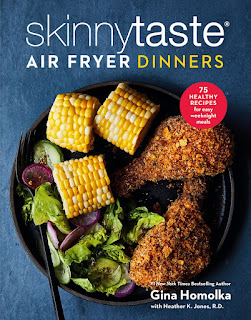 Skinnytaste Air Fryer Dinners by Gina Homolka Cover of the cookbook showing a plate of two breaded drumsticks with some corn on the cob
