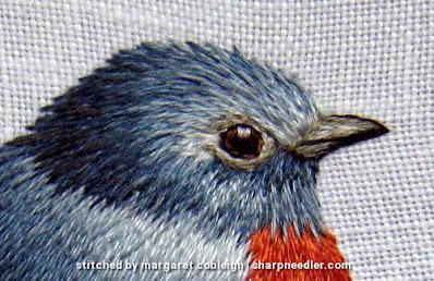 Thread Painted Blue Bird Detail Trish Burr design: Embroidered head of blue bird in needlepainting