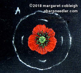 Embroidered remembrance poppy before cutting and mounting Red embroidery remembrance with stitching completed. Ready to be cut and mounted in a pin setting.