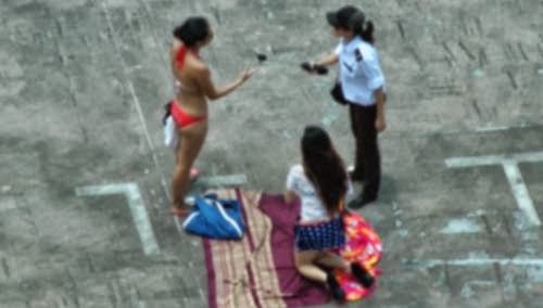 bikini women singapore carpark sun tan