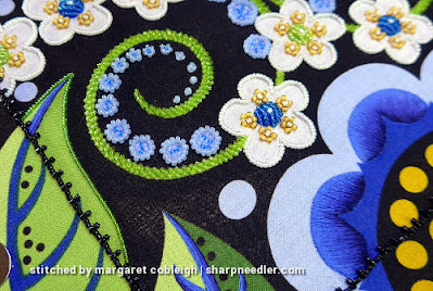 Wild Child: Beaded outlines and thread painted blue petals Japanese bead embroidery showing beaded outlined leaf and needlepainting. (Wild Child Japanese Bead Embroidery by Mary Alice Sinton)