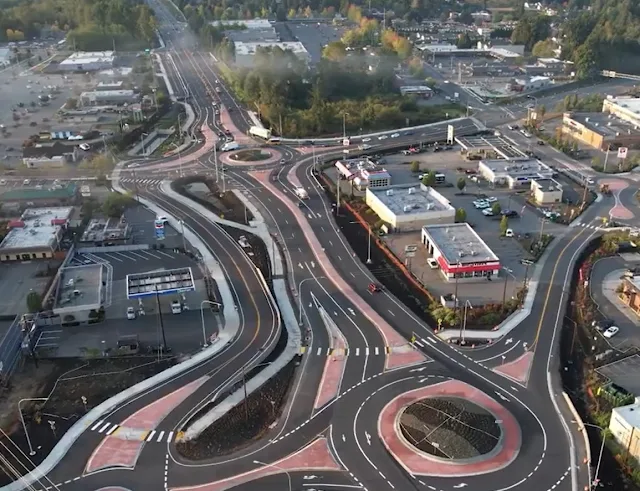 Aerial view of two multi-lane roundabouts in a commercial area of Lake Stevens.