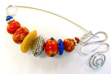 fibula pin by robin atkins, red yellow blue