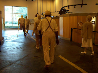 Life size display of mannequins dressed as marchers in a civil rights demonstration