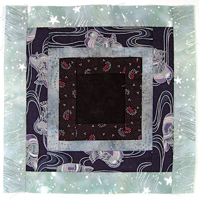 God's Eye quilt by Robin Atkins, auditioning fabrics, finished block