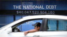 An electronic display shows the national debt in Washington, D.C.