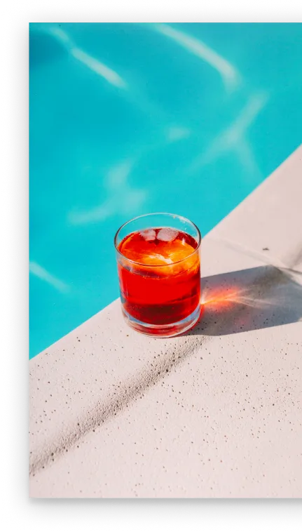 A glass on the side of a swimming pool