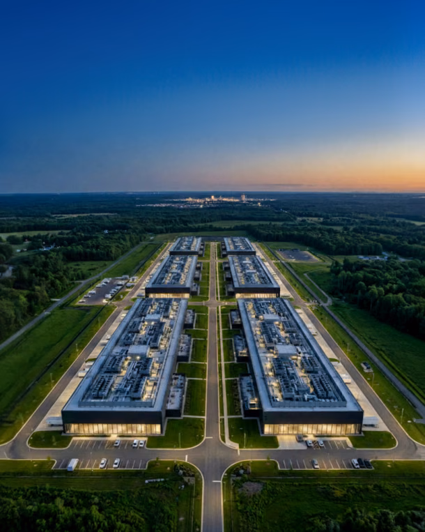 Aerial view of a data center campus at dusk