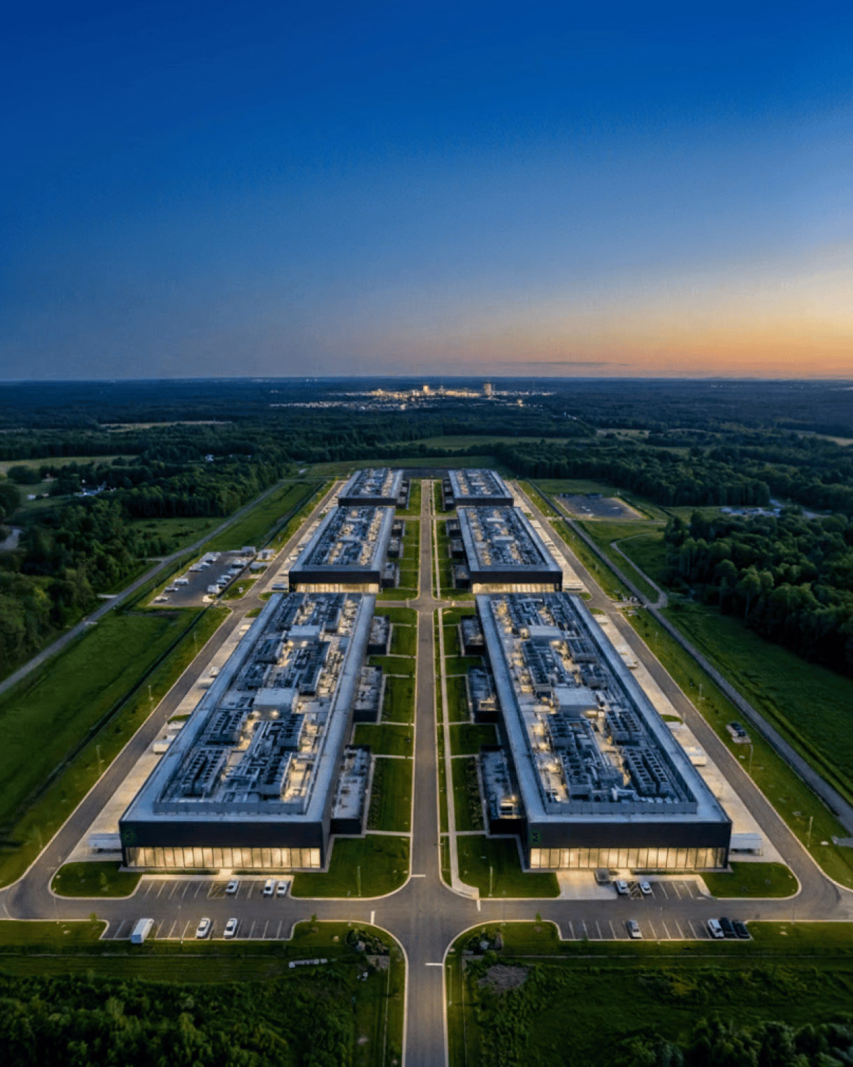 Aerial view of a data center campus at dusk