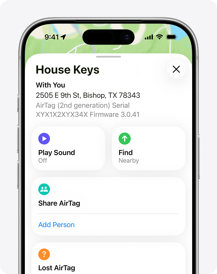 An iPhone showing an item called “House Keys” in the Find My app. Below the address of the item, it shows the model, serial number, and firmware number.