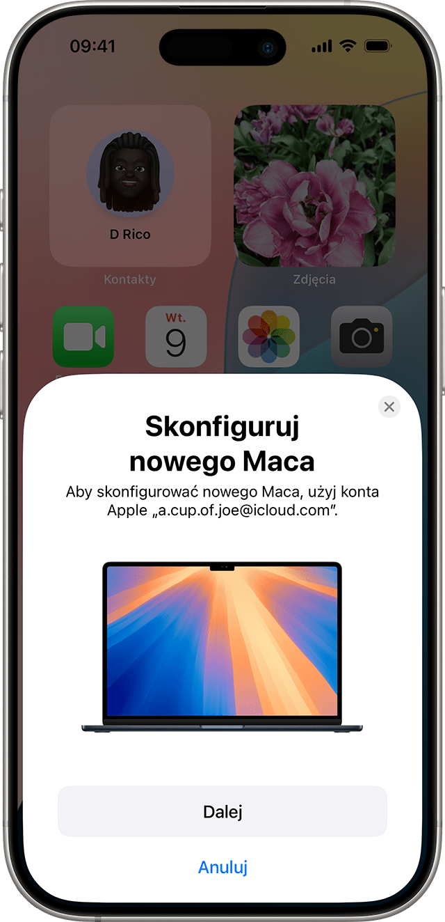 iPhone monitujący o użycie konta Apple do skonfigurowania nowego Maca.