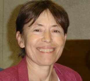 Headshot of Carol Boss, former KUNM volunteer and host of “Peace Talks Radio.”