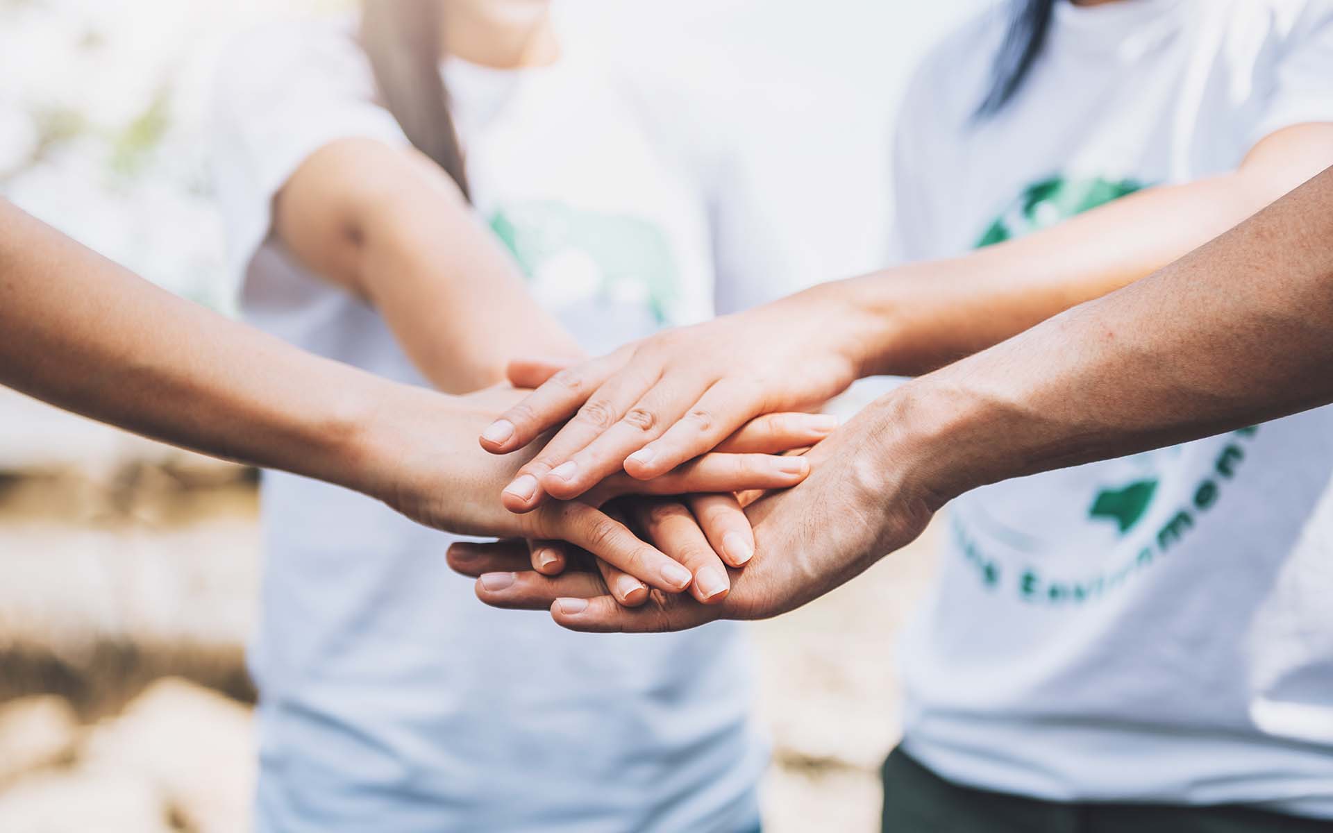 close-up-people-volunteer-teamwork-putting-finger-star-shapehands-togetherstack-handsunity-teamwork-world-environment-day