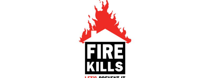 a Fire Kills logo of a house with the roof on fire. Inside the house the words states 'Fire Kills'. At the bottom of the logo text reads 'Let's Prevent It'