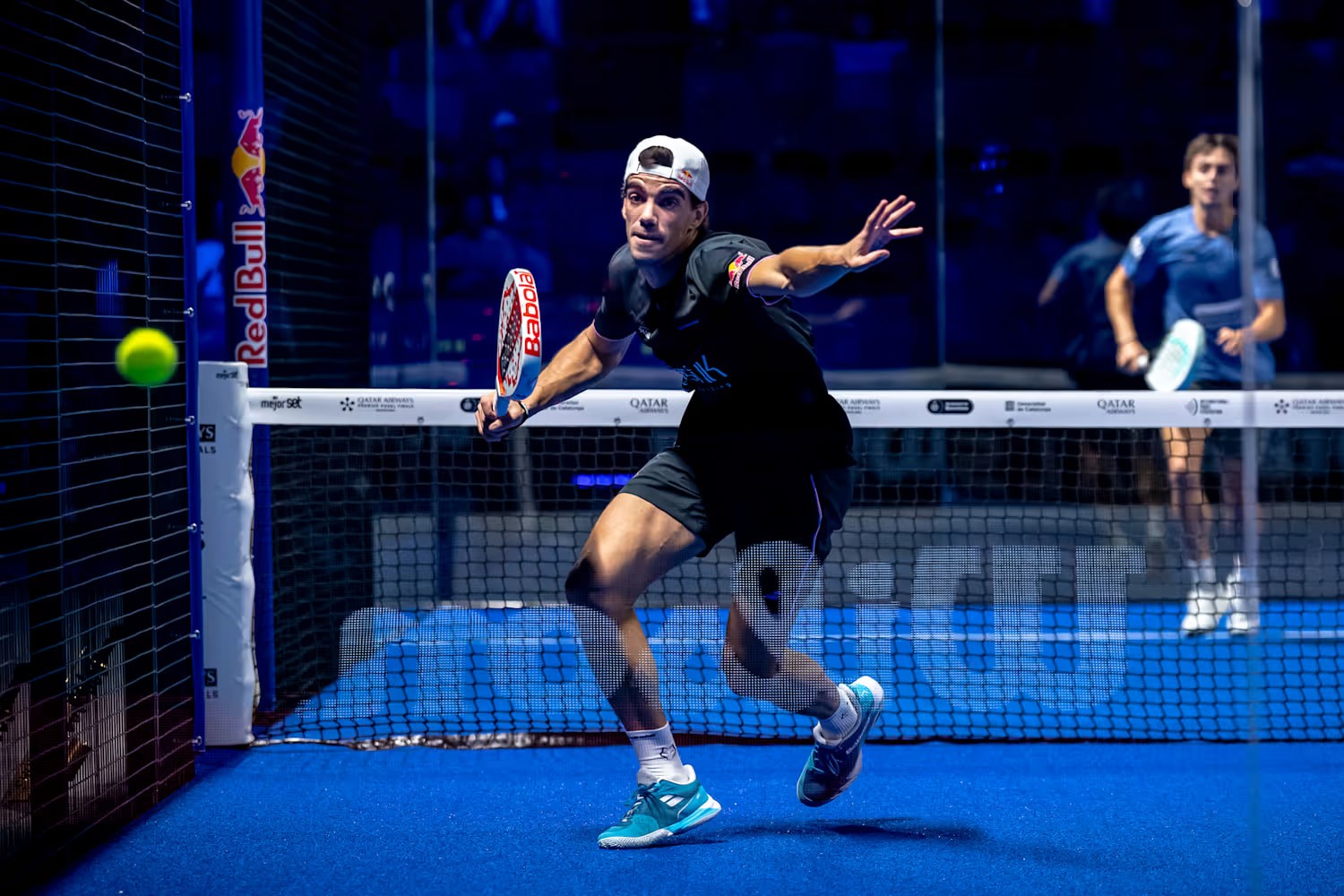 Image of a Padel player reaching for a ball