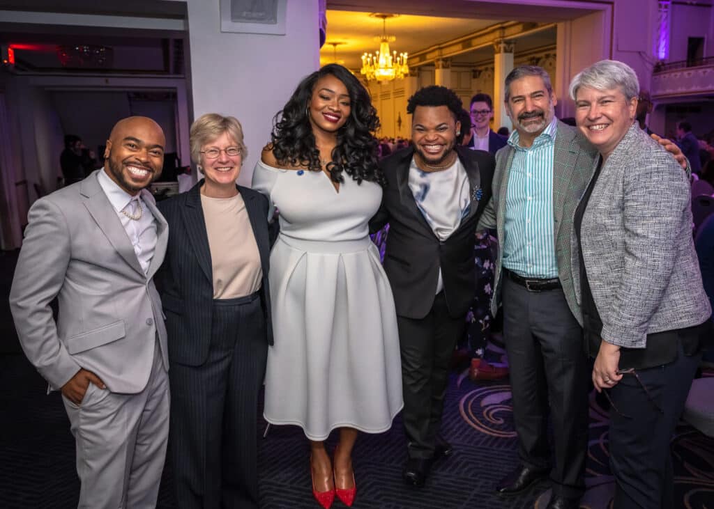 a group of gorgeous folks at a gala event