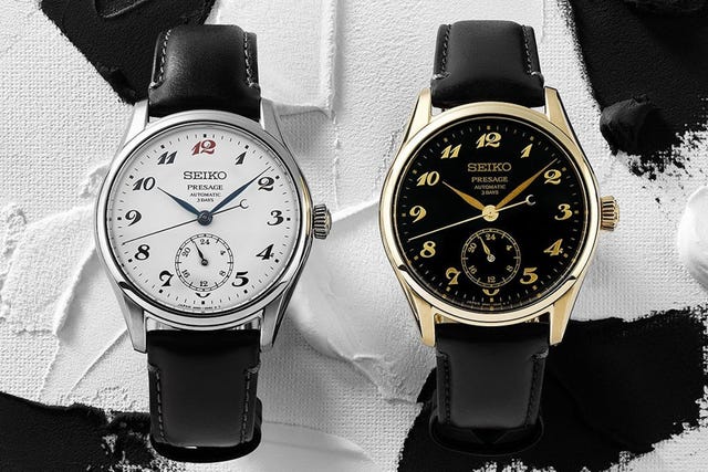 two seiko presage watches, white and black dials, on black leather straps. two seiko presage watches, white and black dials, on black leather straps.