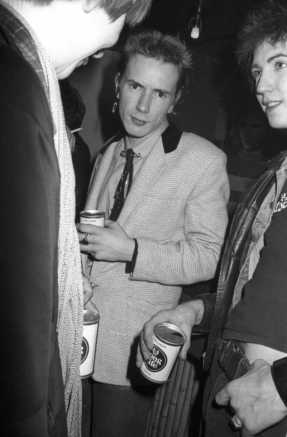 Photo of SEX PISTOLS and Johnny ROTTEN united kingdom january 01 roxy club photo of sex pistols and johnny rotten, posed in crowd at punk gig, holding can of beer photo by erica echenbergredferns
