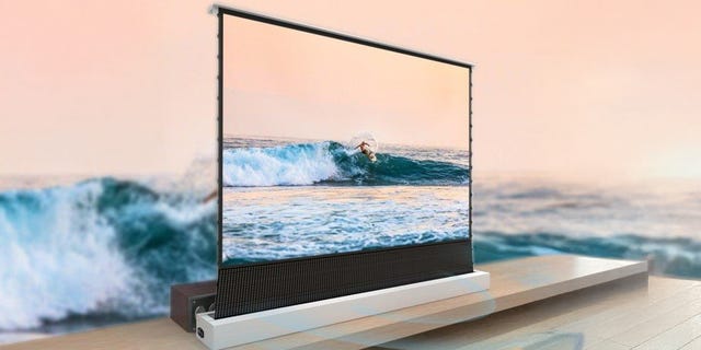 A sleek, modern television displaying a surfing scene with waves and an ocean background. A sleek, modern television displaying a surfing scene with waves and an ocean background.