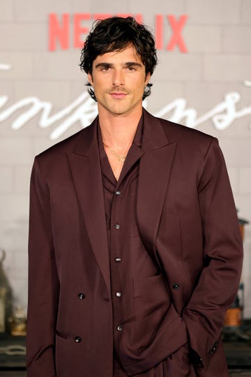 Los Angeles Premiere of Netflix's "Frankenstein" Jacob Elordi poses for photo wearing burgundy suit