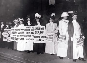 Suffragettes Marching with Signs suffragettes marching with signs