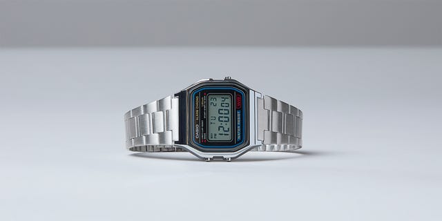 Digital Casio watch with a stainless steel band, displaying the time and various功能. Digital Casio watch with a stainless steel band, displaying the time and various功能.