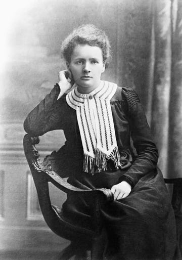 Marie Curie scientist marie curie sitting in a chair