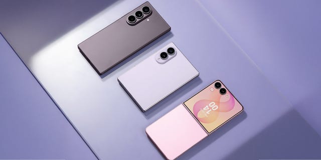 Three smartphones arranged on a pastel background, showcasing different colors and designs. Three smartphones arranged on a pastel background, showcasing different colors and designs.